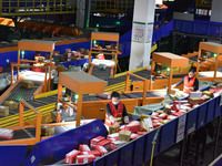 Employees of China Post Express Logistics sort express parcels at an intelligent automatic line in Fuyang, China, on November 7, 2024. (