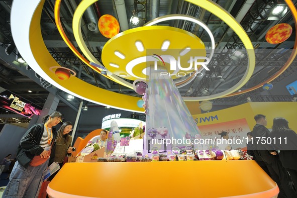 Visitors visit the booth of JOYVIO Food at the 7th CIIE in Shanghai, China, on November 7, 2024. 