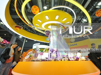 Visitors visit the booth of JOYVIO Food at the 7th CIIE in Shanghai, China, on November 7, 2024. (