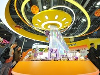 Visitors visit the booth of JOYVIO Food at the 7th CIIE in Shanghai, China, on November 7, 2024. (