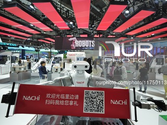 A twin-wrist robot welcomes visitors at the Nachi booth of the 7th CIIE in Shanghai, China, on November 7, 2024. (