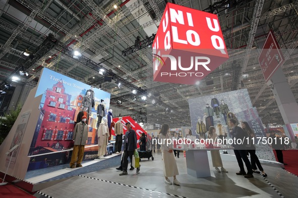 Visitors visit the Uniqlo booth at the 7th CIEXPO in Shanghai, China, on November 7, 2024. 