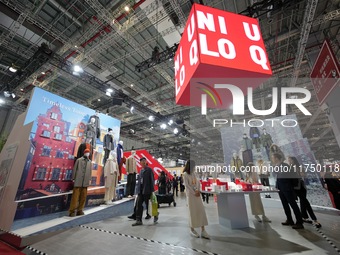 Visitors visit the Uniqlo booth at the 7th CIEXPO in Shanghai, China, on November 7, 2024. (