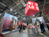 Visitors visit the Uniqlo booth at the 7th CIEXPO in Shanghai, China, on November 7, 2024. (