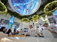 The audience tastes food at the Serbian National Pavilion of the 7th CIIE in Shanghai, China, on November 7, 2024. (