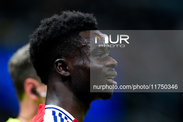 Bukayo Saka of Arsenal looks on during the UEFA Champions League 2024/25 League Phase MD4 match between FC Internazionale and Arsenal at Sta...