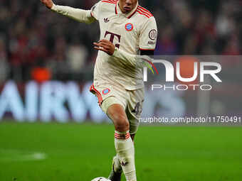 Jamal Musiala of Bayern Munich  controls the ball during the Champions League Round 4 match between Bayern Munich v Benfica at the Allianz a...