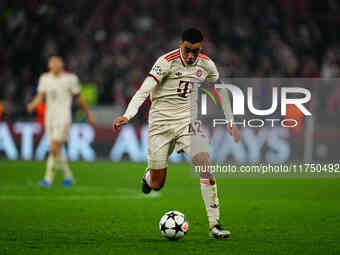 Jamal Musiala of Bayern Munich  controls the ball during the Champions League Round 4 match between Bayern Munich v Benfica at the Allianz a...