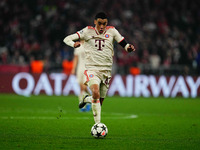 Jamal Musiala of Bayern Munich  controls the ball during the Champions League Round 4 match between Bayern Munich v Benfica at the Allianz a...