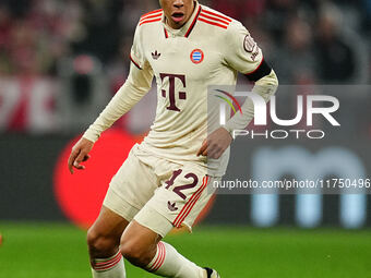 Jamal Musiala of Bayern Munich  controls the ball during the Champions League Round 4 match between Bayern Munich v Benfica at the Allianz a...