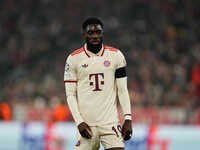 Alphonso Davies of Bayern Munich  looks on during the Champions League Round 4 match between Bayern Munich v Benfica at the Allianz arena, M...