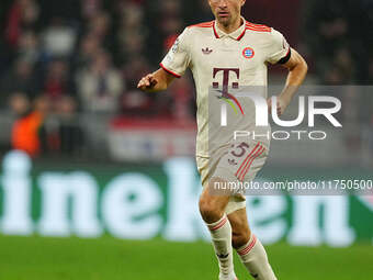 Thomas Muller of Bayern Munich  controls the ball during the Champions League Round 4 match between Bayern Munich v Benfica at the Allianz a...