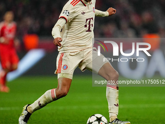 Jamal Musiala of Bayern Munich  controls the ball during the Champions League Round 4 match between Bayern Munich v Benfica at the Allianz a...