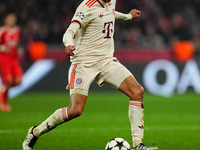 Jamal Musiala of Bayern Munich  controls the ball during the Champions League Round 4 match between Bayern Munich v Benfica at the Allianz a...