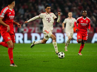 Jamal Musiala of Bayern Munich  controls the ball during the Champions League Round 4 match between Bayern Munich v Benfica at the Allianz a...