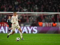 Jamal Musiala of Bayern Munich  controls the ball during the Champions League Round 4 match between Bayern Munich v Benfica at the Allianz a...