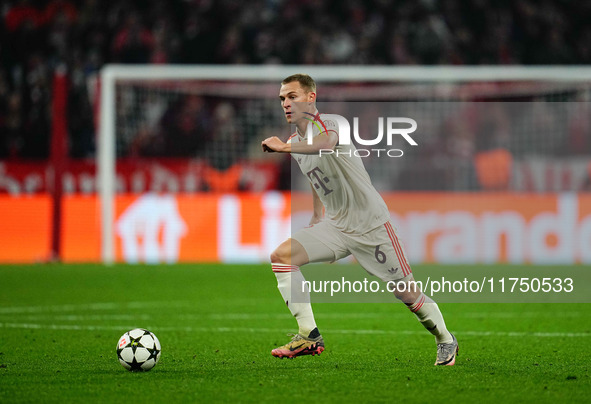 Joshua Kimmich of Bayern Munich  controls the ball during the Champions League Round 4 match between Bayern Munich v Benfica at the Allianz...