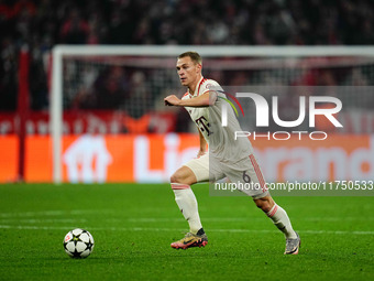 Joshua Kimmich of Bayern Munich  controls the ball during the Champions League Round 4 match between Bayern Munich v Benfica at the Allianz...