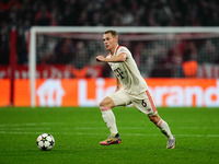 Joshua Kimmich of Bayern Munich  controls the ball during the Champions League Round 4 match between Bayern Munich v Benfica at the Allianz...