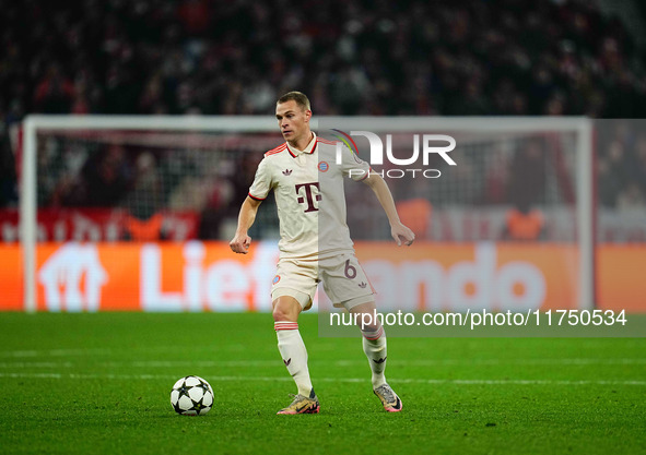 Joshua Kimmich of Bayern Munich  controls the ball during the Champions League Round 4 match between Bayern Munich v Benfica at the Allianz...