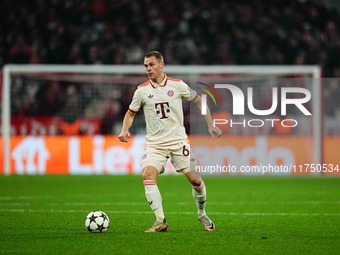 Joshua Kimmich of Bayern Munich  controls the ball during the Champions League Round 4 match between Bayern Munich v Benfica at the Allianz...