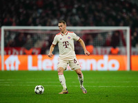 Joshua Kimmich of Bayern Munich  controls the ball during the Champions League Round 4 match between Bayern Munich v Benfica at the Allianz...