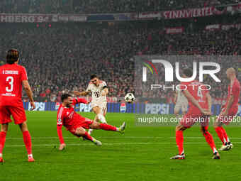 Joao Palhinha of Bayern Munich  shoots on goal during the Champions League Round 4 match between Bayern Munich v Benfica at the Allianz aren...