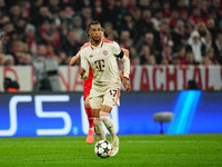 Michael Olise of Bayern Munich  controls the ball during the Champions League Round 4 match between Bayern Munich v Benfica at the Allianz a...