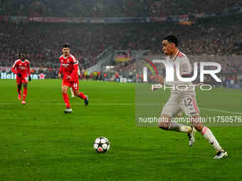 Jamal Musiala of Bayern Munich  controls the ball during the Champions League Round 4 match between Bayern Munich v Benfica at the Allianz a...