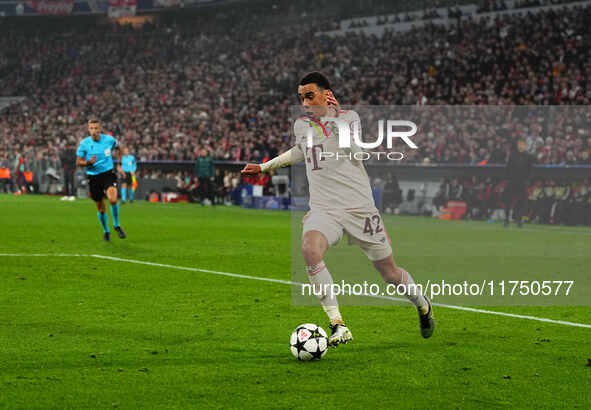 Jamal Musiala of Bayern Munich  controls the ball during the Champions League Round 4 match between Bayern Munich v Benfica at the Allianz a...