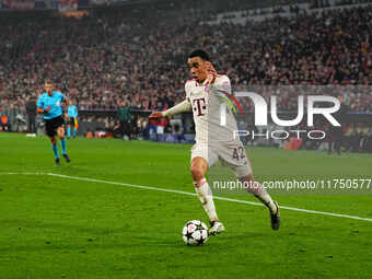 Jamal Musiala of Bayern Munich  controls the ball during the Champions League Round 4 match between Bayern Munich v Benfica at the Allianz a...