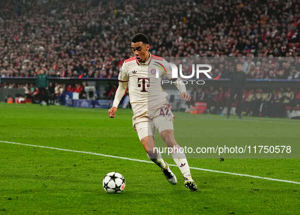 Jamal Musiala of Bayern Munich  controls the ball during the Champions League Round 4 match between Bayern Munich v Benfica at the Allianz a...