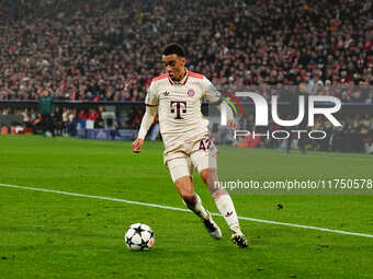 Jamal Musiala of Bayern Munich  controls the ball during the Champions League Round 4 match between Bayern Munich v Benfica at the Allianz a...