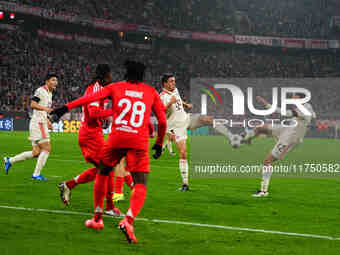 Jamal Musiala of Bayern Munich  shoots on goal during the Champions League Round 4 match between Bayern Munich v Benfica at the Allianz aren...