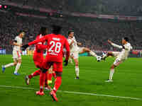 Jamal Musiala of Bayern Munich  shoots on goal during the Champions League Round 4 match between Bayern Munich v Benfica at the Allianz aren...