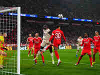 Dayot Upamecano of Bayern Munich  heads during the Champions League Round 4 match between Bayern Munich v Benfica at the Allianz arena, Muni...