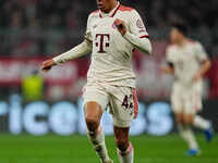 Jamal Musiala of Bayern Munich  controls the ball during the Champions League Round 4 match between Bayern Munich v Benfica at the Allianz a...