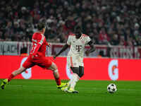 Dayot Upamecano of Bayern Munich  controls the ball during the Champions League Round 4 match between Bayern Munich v Benfica at the Allianz...