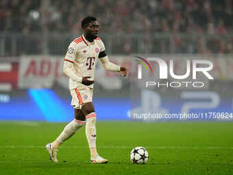 Alphonso Davies of Bayern Munich  controls the ball during the Champions League Round 4 match between Bayern Munich v Benfica at the Allianz...