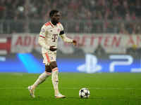 Alphonso Davies of Bayern Munich  controls the ball during the Champions League Round 4 match between Bayern Munich v Benfica at the Allianz...