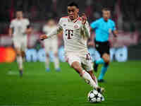 Jamal Musiala of Bayern Munich  controls the ball during the Champions League Round 4 match between Bayern Munich v Benfica at the Allianz a...