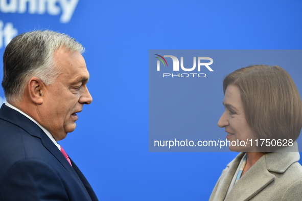 Maia Sandu, President of Moldova, is greeted by Viktor Orban, Hungarian Prime Minister, before the 5th European Political Community Summit i...