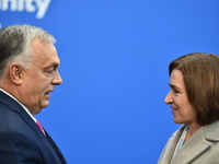 Maia Sandu, President of Moldova, is greeted by Viktor Orban, Hungarian Prime Minister, before the 5th European Political Community Summit i...