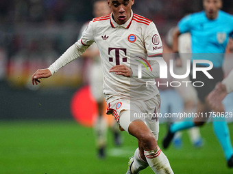 Jamal Musiala of Bayern Munich  controls the ball during the Champions League Round 4 match between Bayern Munich v Benfica at the Allianz a...