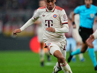 Jamal Musiala of Bayern Munich  controls the ball during the Champions League Round 4 match between Bayern Munich v Benfica at the Allianz a...