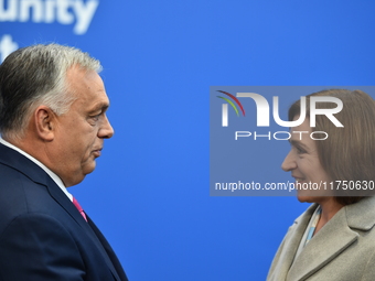 Maia Sandu, President of Moldova, is greeted by Viktor Orban, Hungarian Prime Minister, before the 5th European Political Community Summit i...