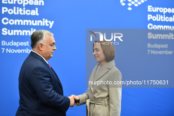 Maia Sandu, President of Moldova, is greeted by Viktor Orban, Hungarian Prime Minister, before the 5th European Political Community Summit i...