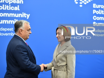 Maia Sandu, President of Moldova, is greeted by Viktor Orban, Hungarian Prime Minister, before the 5th European Political Community Summit i...