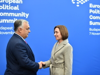 Maia Sandu, President of Moldova, is greeted by Viktor Orban, Hungarian Prime Minister, before the 5th European Political Community Summit i...