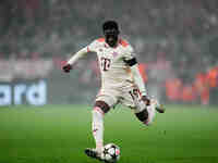 Alphonso Davies of Bayern Munich  controls the ball during the Champions League Round 4 match between Bayern Munich v Benfica at the Allianz...